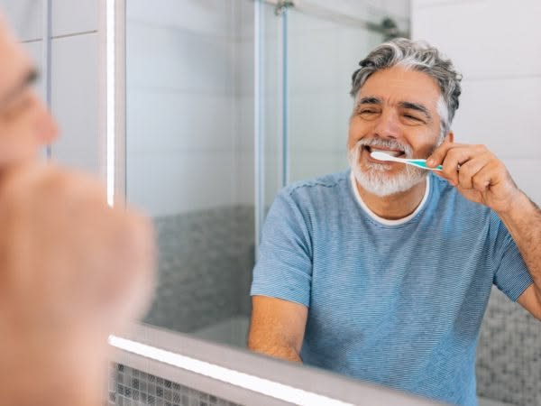 Older adult maintaining a consistent daily brushing routine