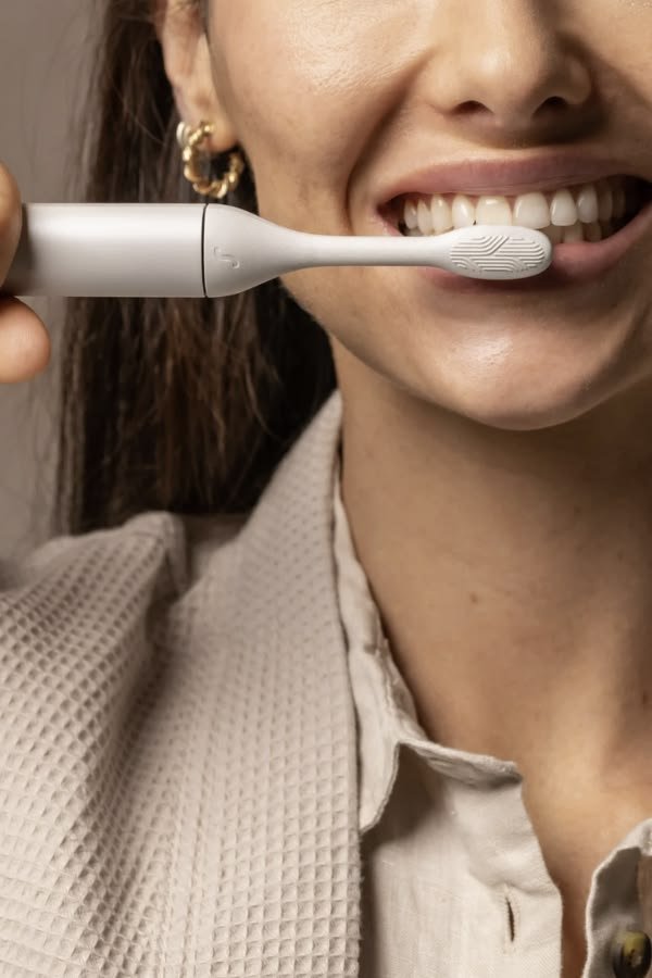Close-up of a modern toothbrush supporting responsible oral-care innovation